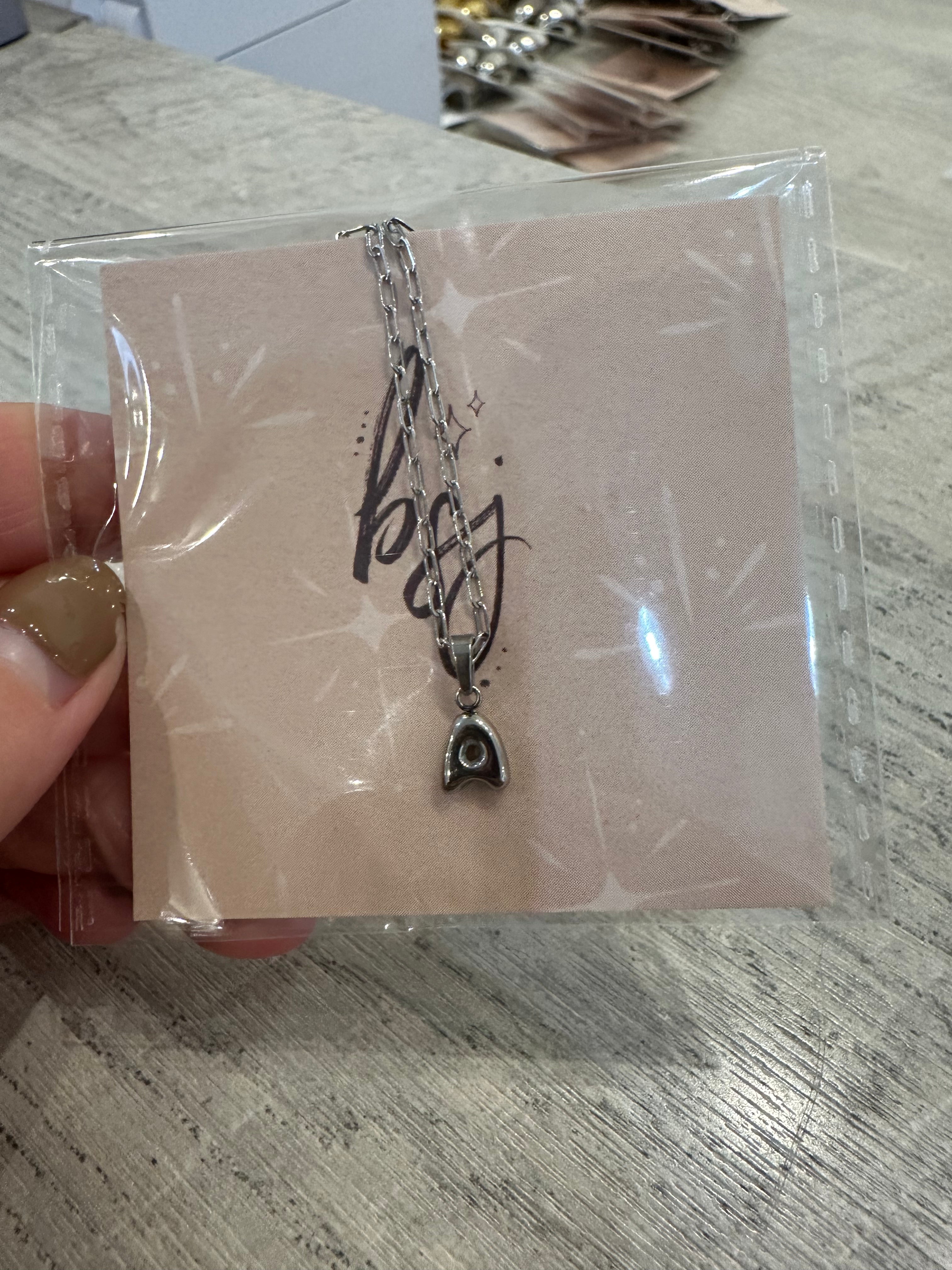 bubble letter necklace - a